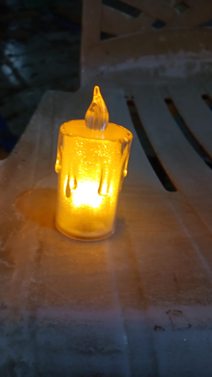 Styleva's durable transparent LED candle, showcasing its intricate glitter swirling mechanism.