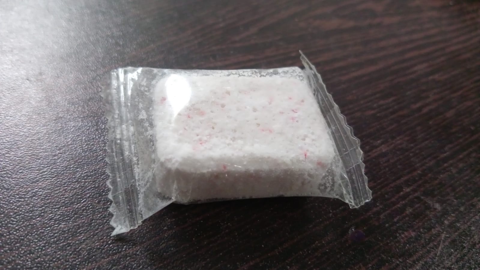 Single washing machine cleaning tablet for household use.
