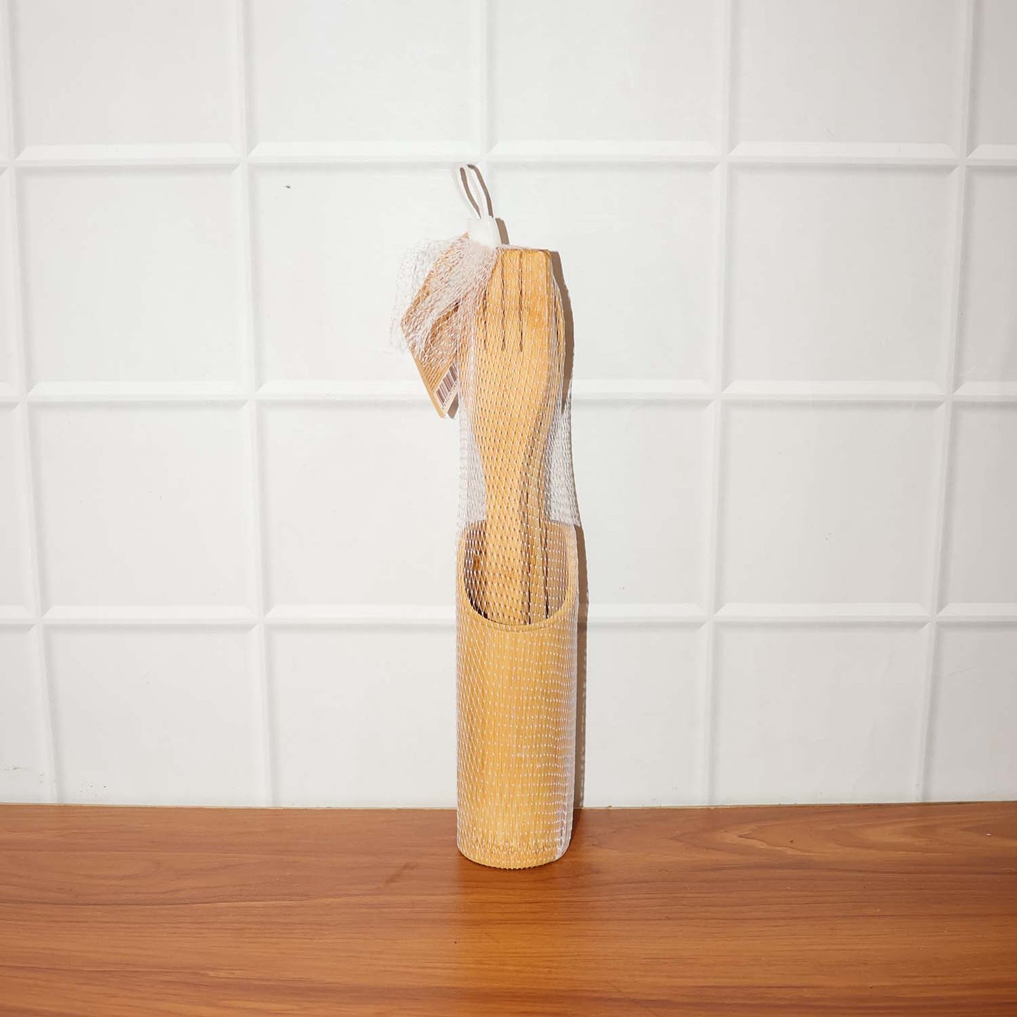 Natural bamboo cooking spatula set styled on kitchen counter