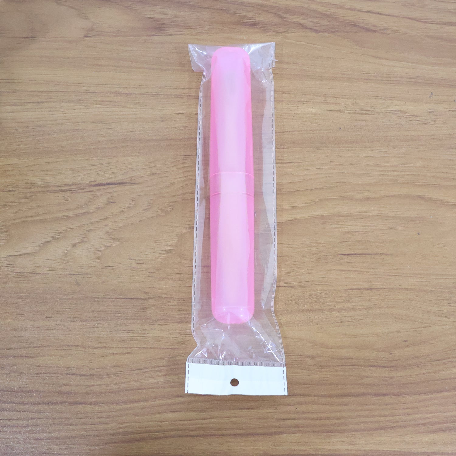 Person demonstrating the use of the 2-in-1 Toothbrush and tongue cleaner.