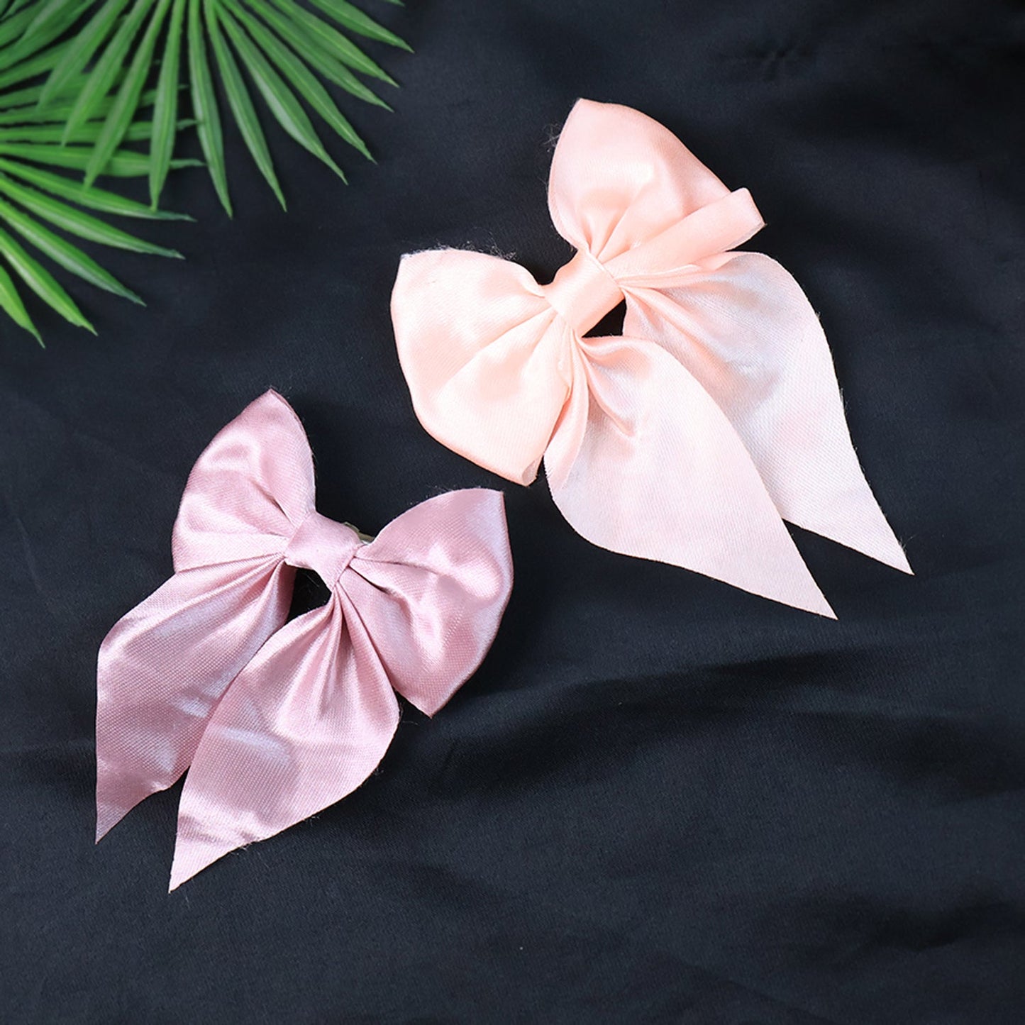 Additional satin bow hair clip featuring double tail and clip detail