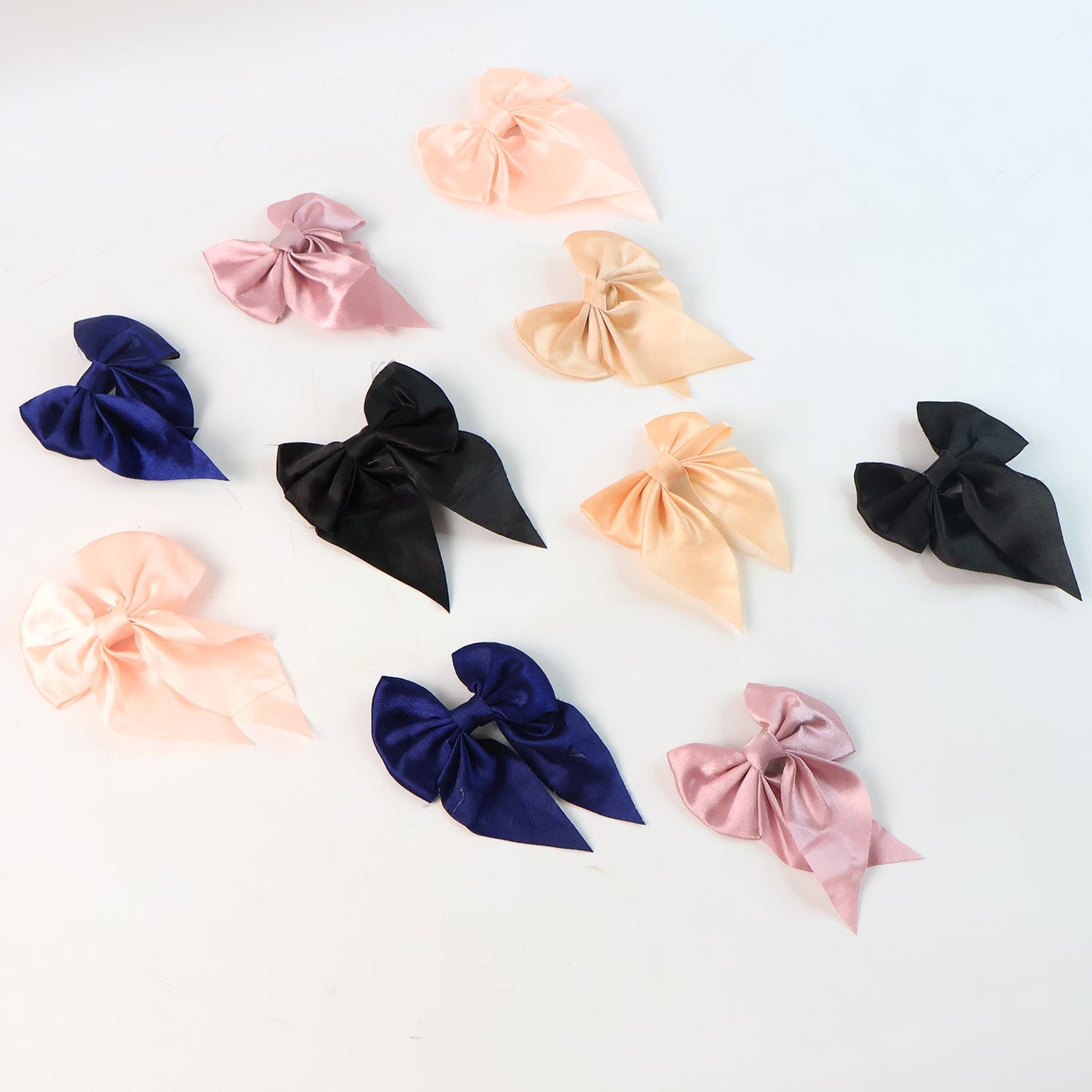 Variety of colorful satin bow hair clips for versatile styling