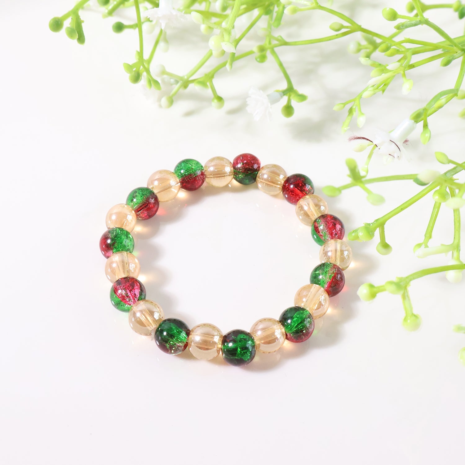 Glossy bead charm detail on multicolor stretch bracelet