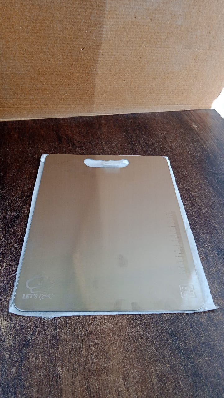 Durable stainless steel cutting board with handle, perfect for home kitchens
