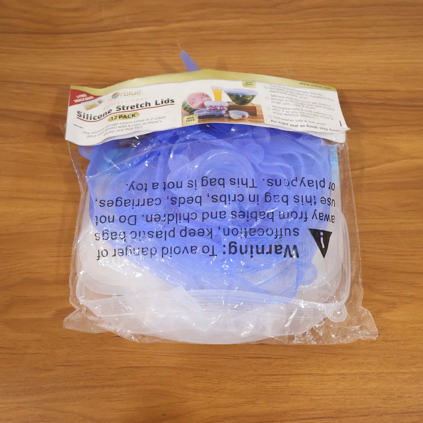 Silicone stretch lids organized neatly in two storage pouches