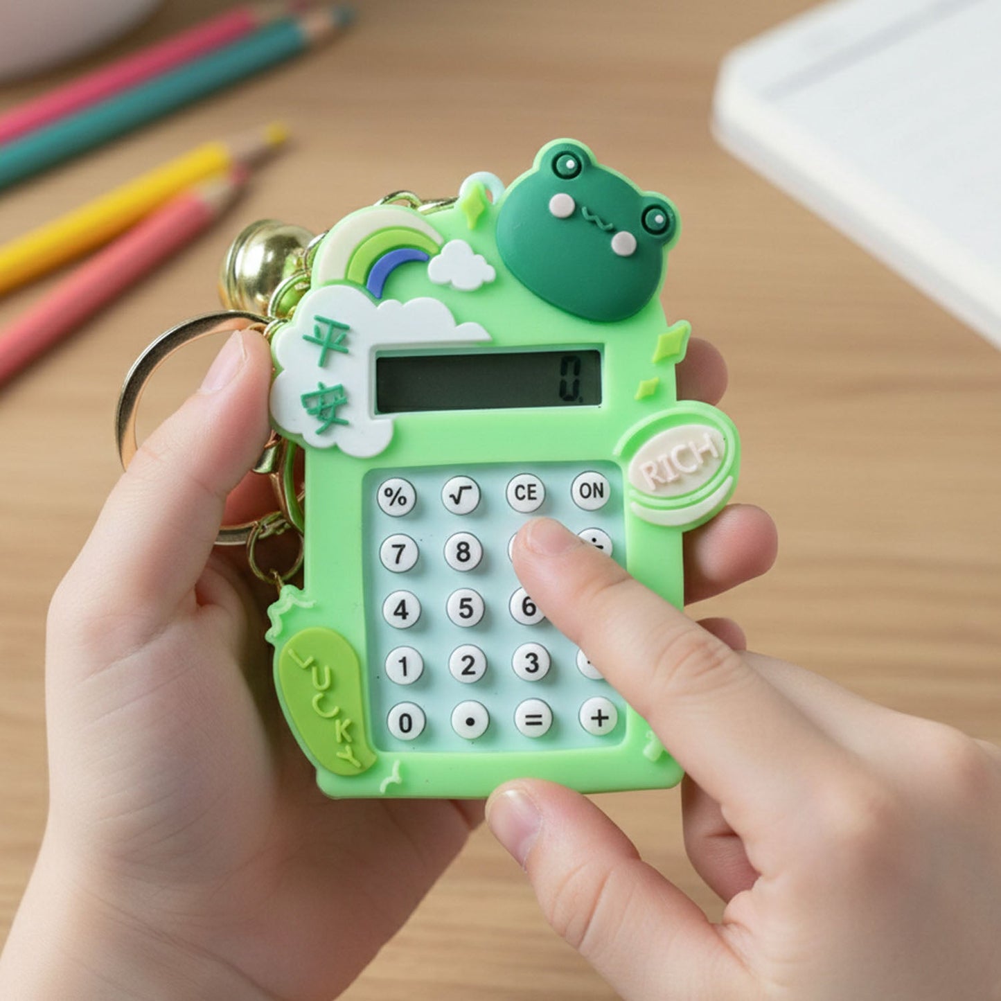 Frog cartoon themed calculator keychain as a fun and practical accessory