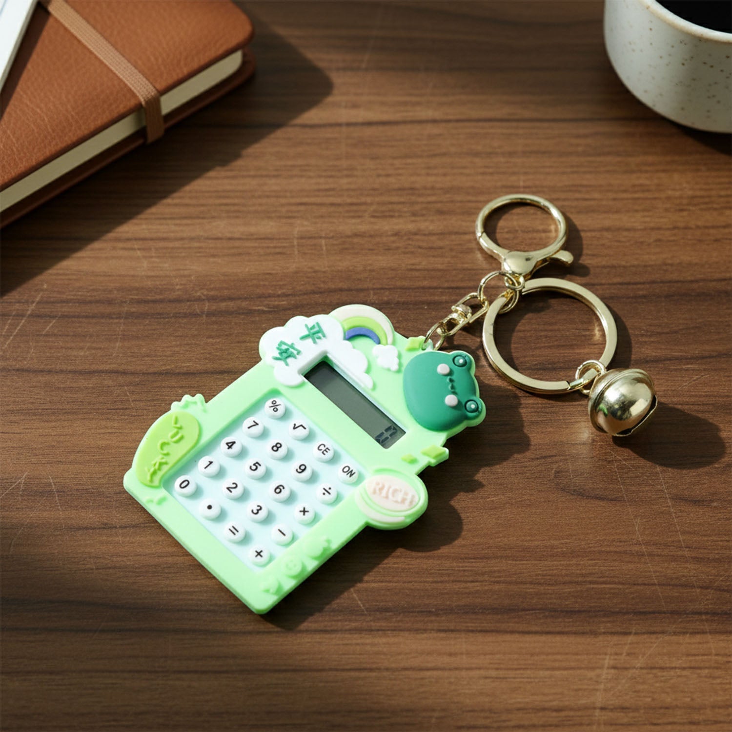 Close up of frog calculator keychain’s buttons and digital display screen
