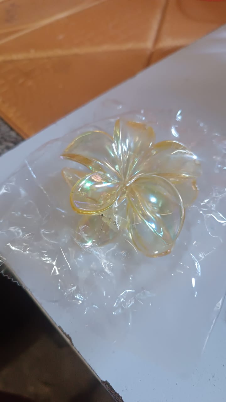 Side view of durable plastic hair clamp with simple design