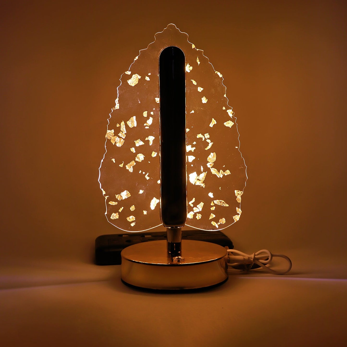 Stand-alone image of golden crystal leaf-shaped LED table lamp