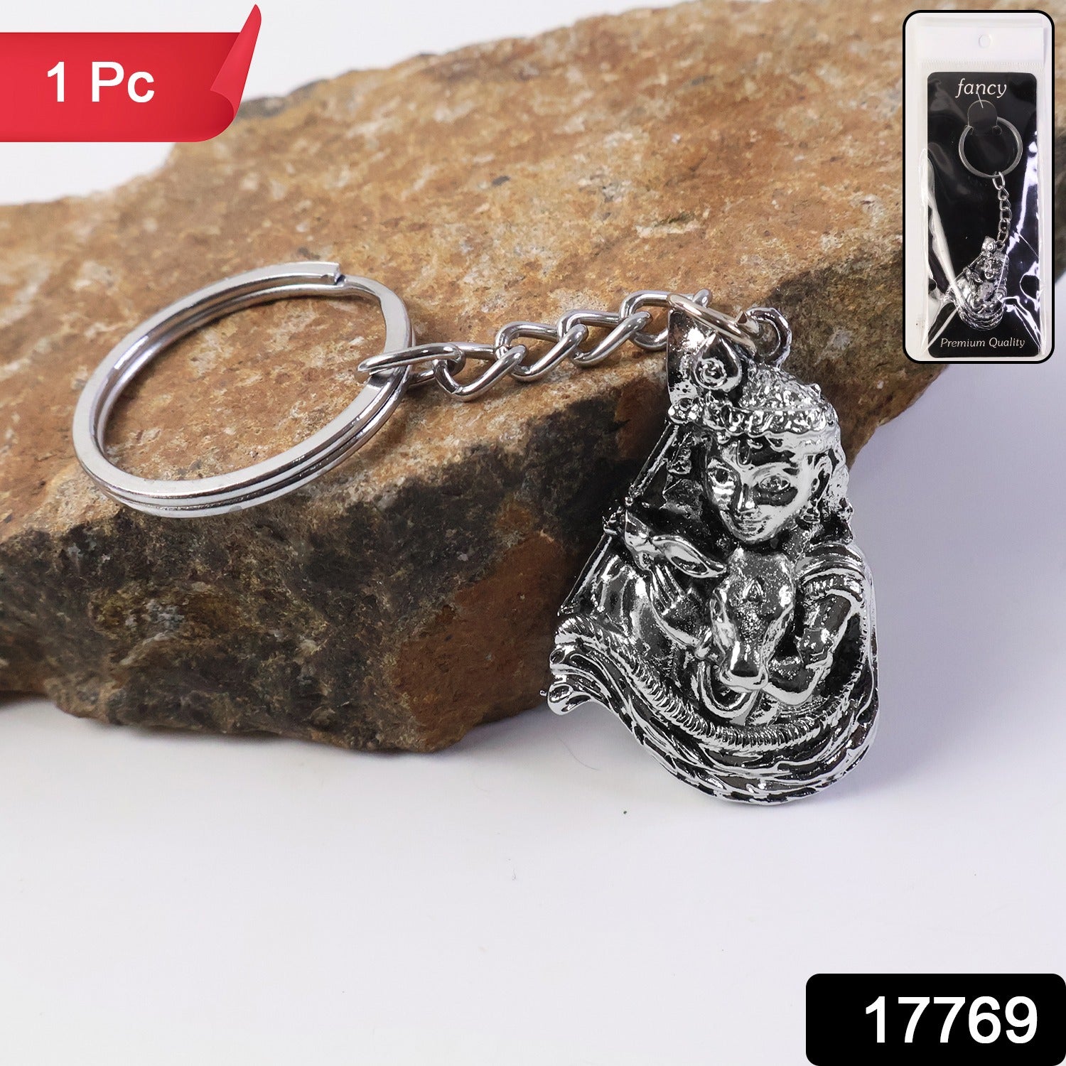 Close-up of Bal Krishna idol on silver finish metal keychain showing intricate craftsmanship
