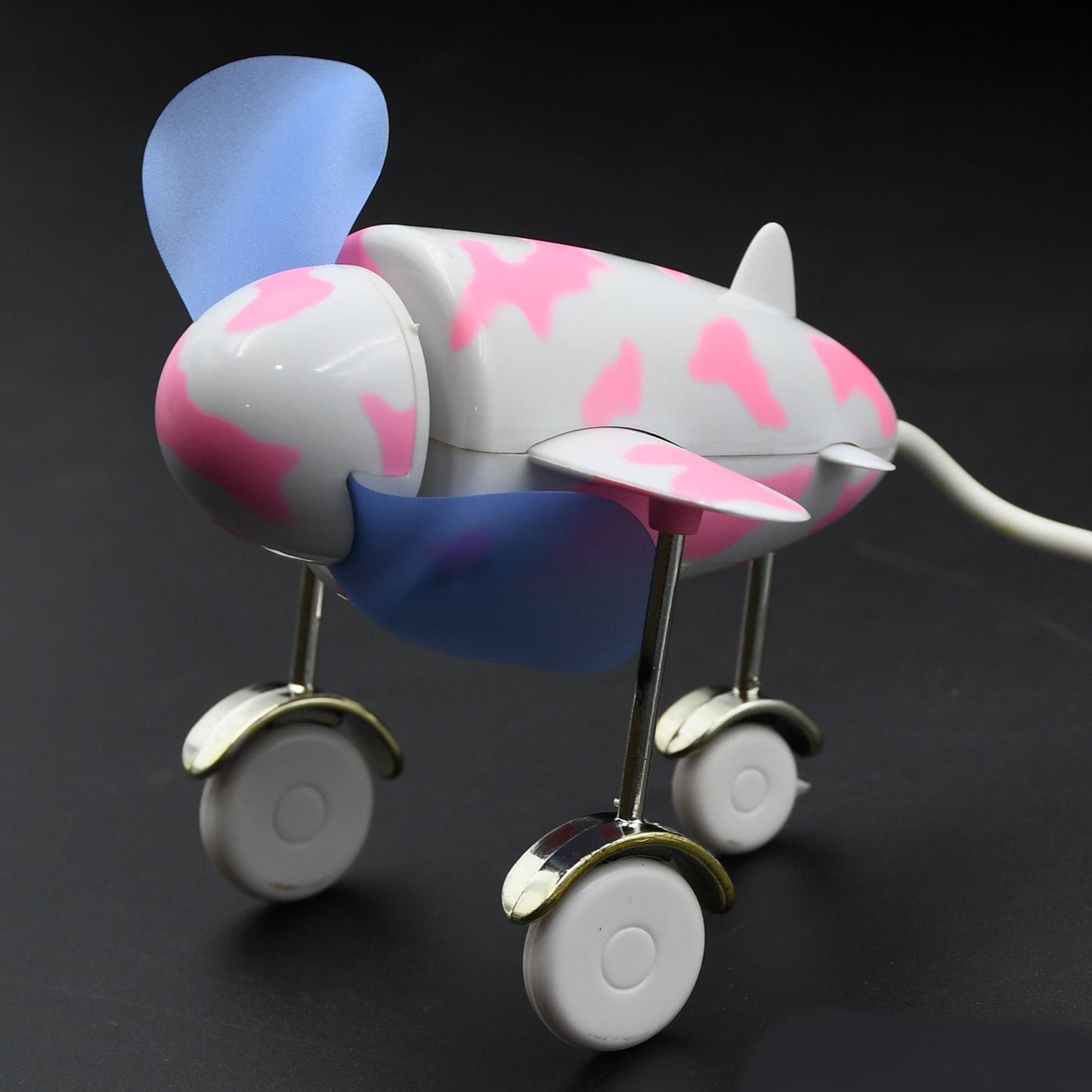 Compact USB plane fan with a unique design for laptops and desktops.