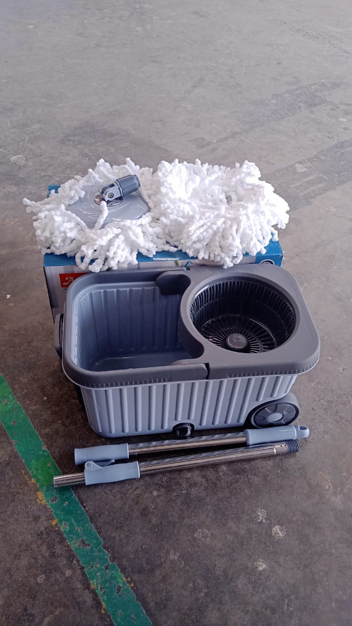 Person using Apex Magic Spin Mop cleaning floor effortlessly