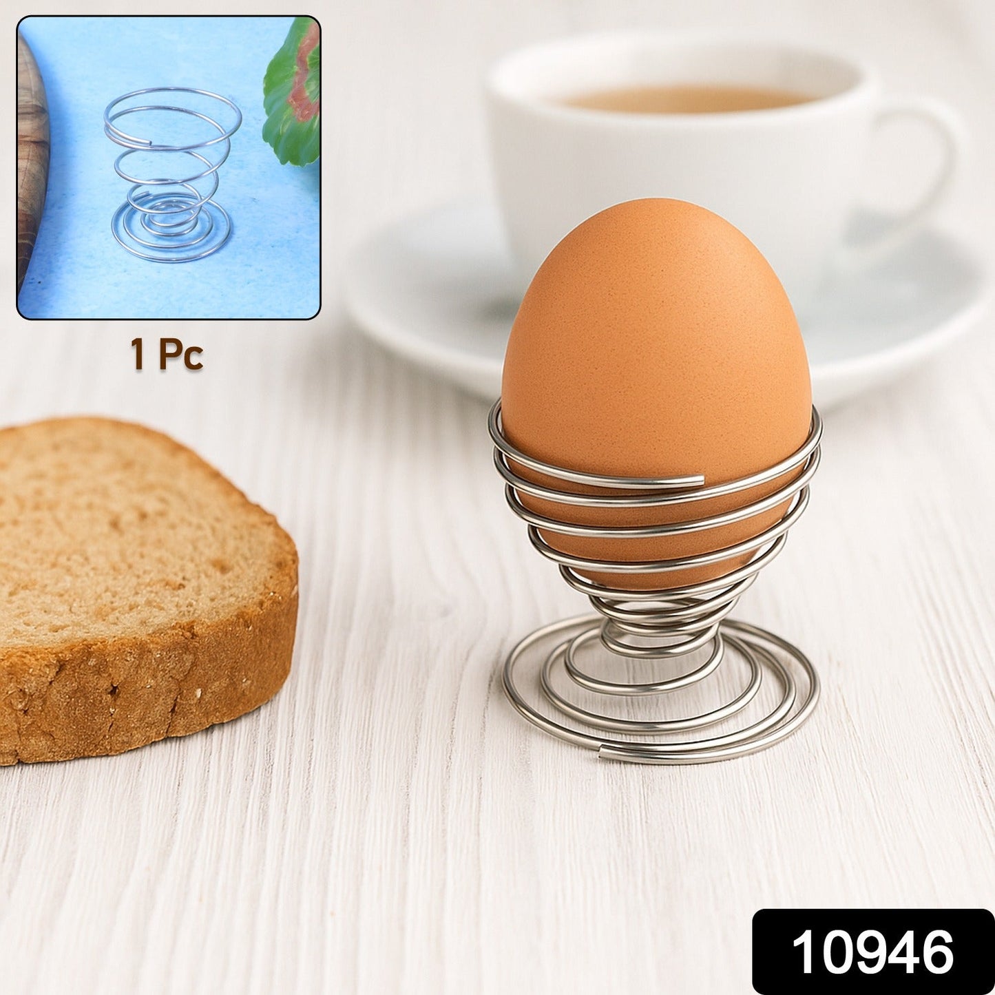 Close-up of stainless steel spring egg holder holding a soft-boiled egg