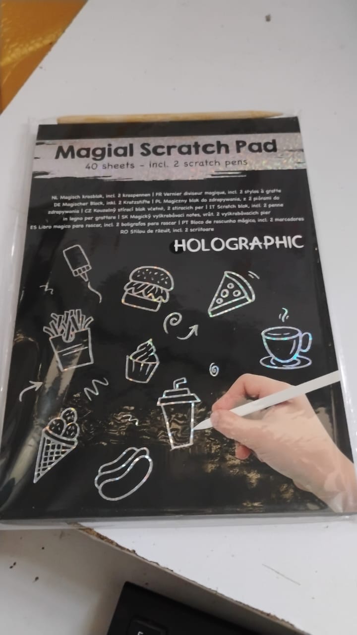 Scratch art sheets displaying vivid, colourful artwork patterns