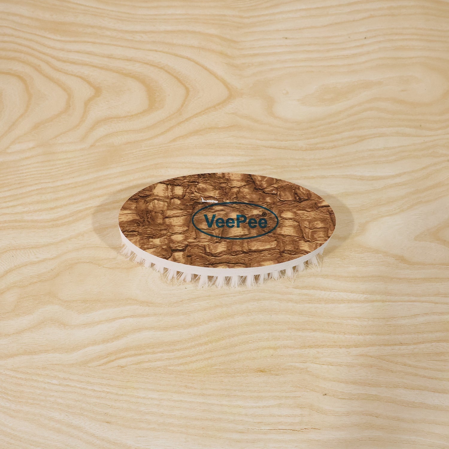 The stylish printed design on the top surface of the heavy-duty cloth washing brush.