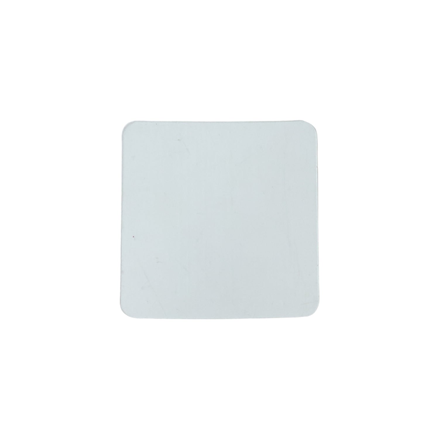 Flat lay of transparent square nano adhesive tape pads