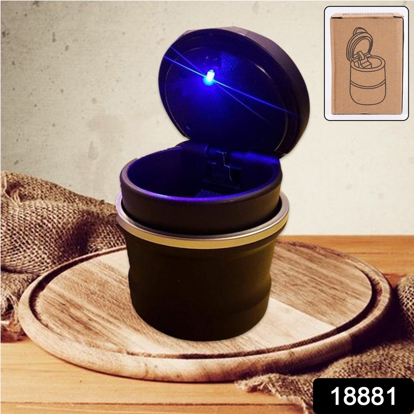 Close-up of blue LED illuminated car ashtray in cylinder shape