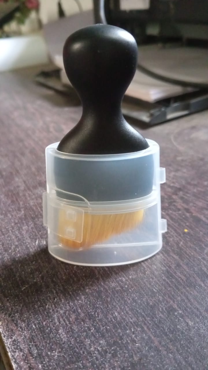 Upright display of the mini car interior cleaning brush.