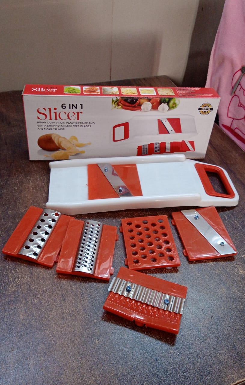 All components of the Quickslice kitchen food prep tool laid out.