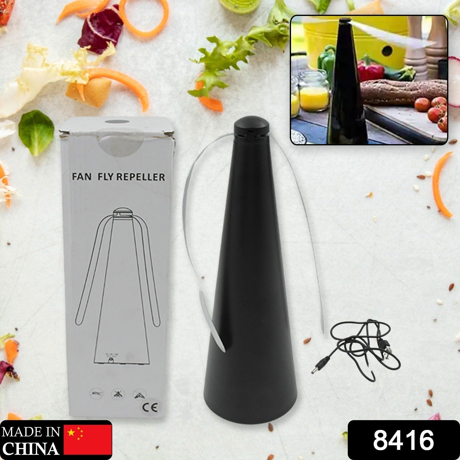 Tabletop fly repellent fan in use, keeping food safe from pests.