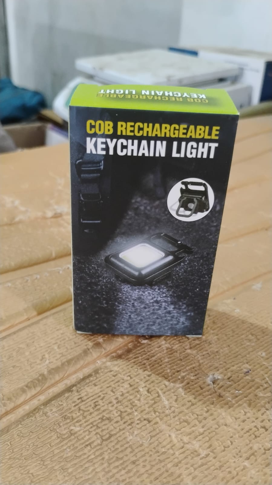 Side view of the rechargeable keychain flashlight with its magnetic base.