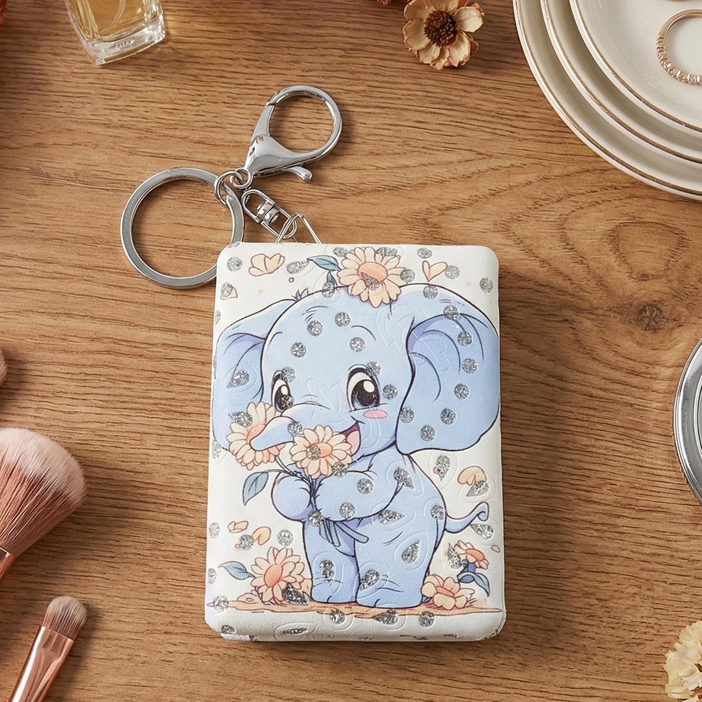 Foldable compact mirror keychain showing durable build and metal keyring