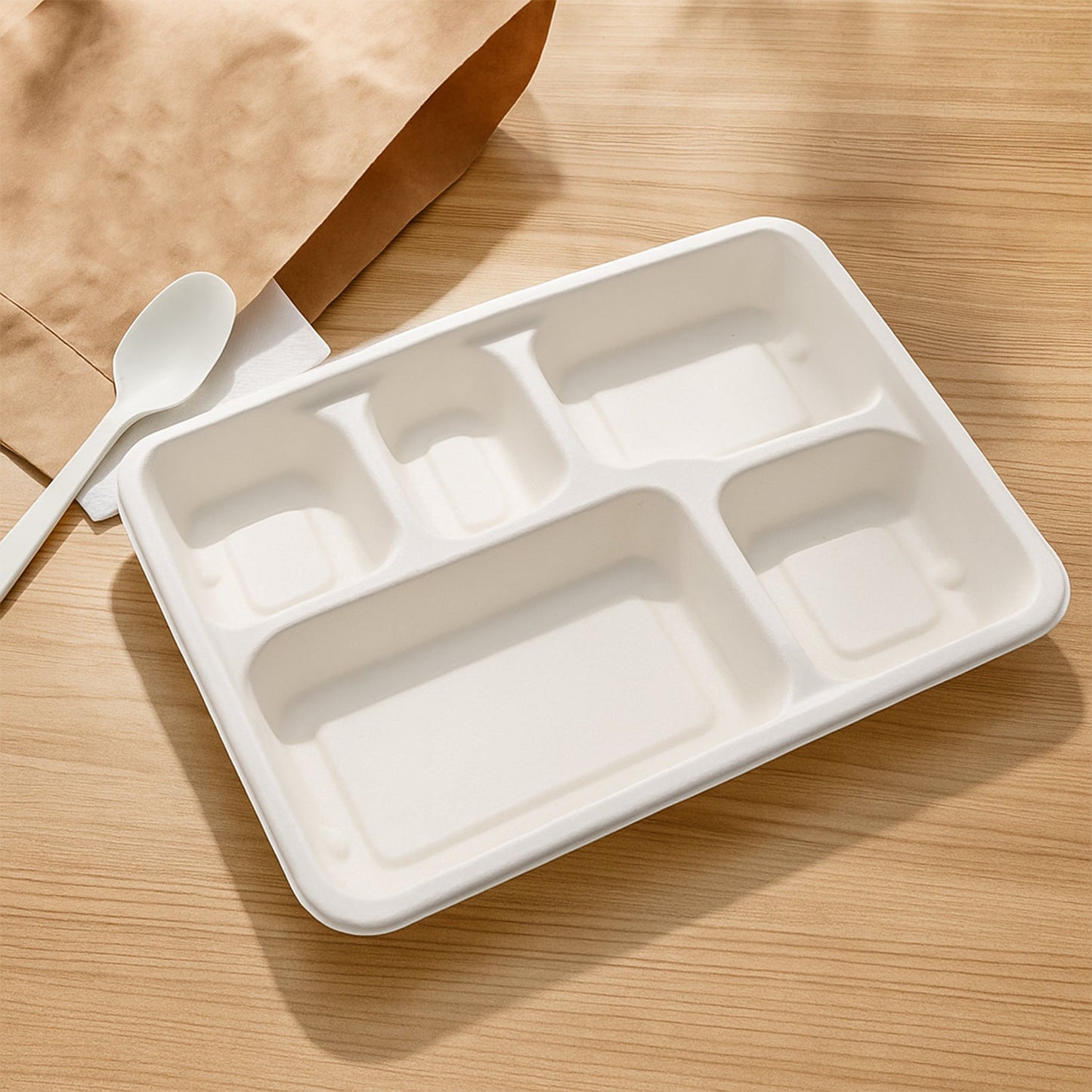 Natural color compostable lunch plate displaying five meal sections