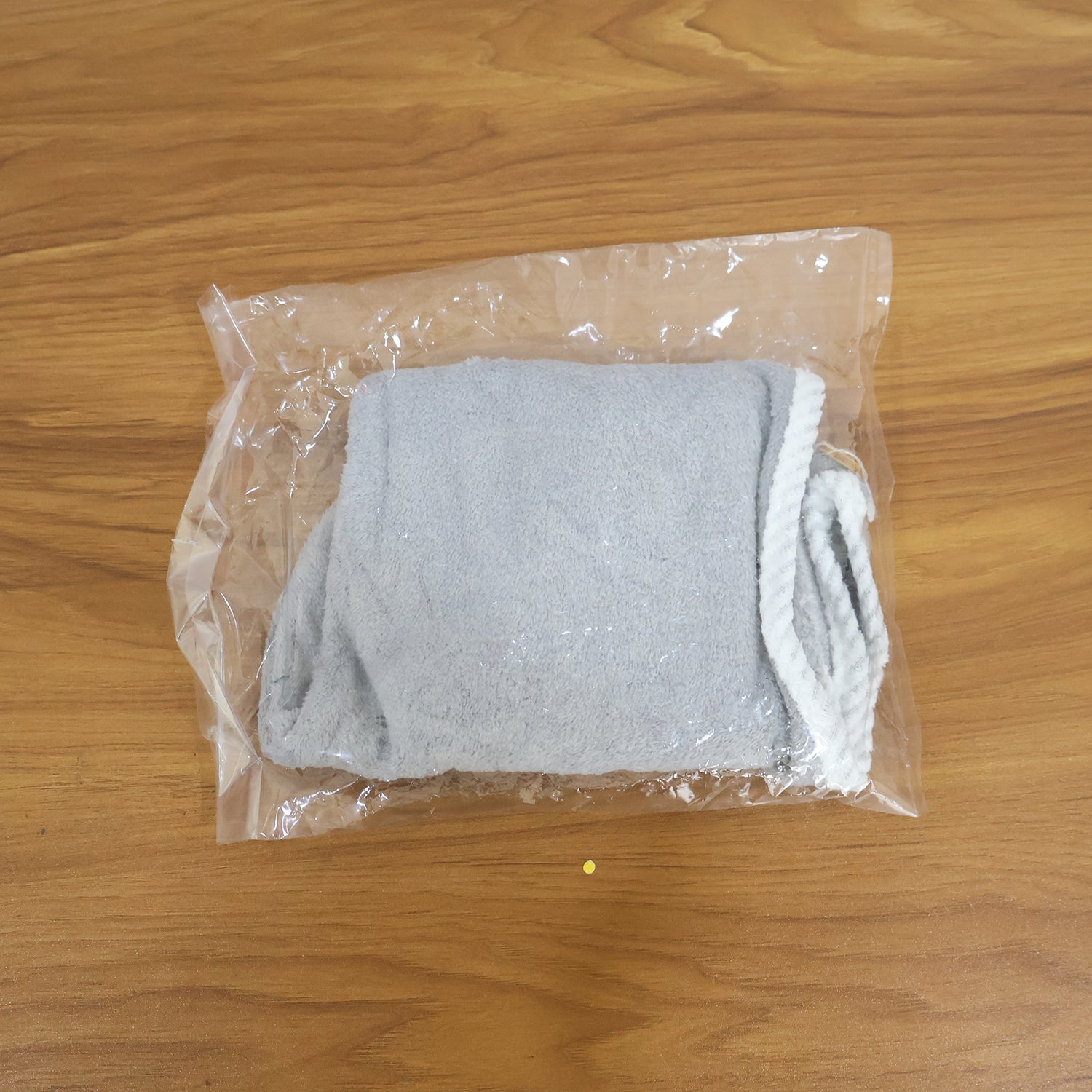 Woman comfortably wearing the turban towel for women while relaxing.