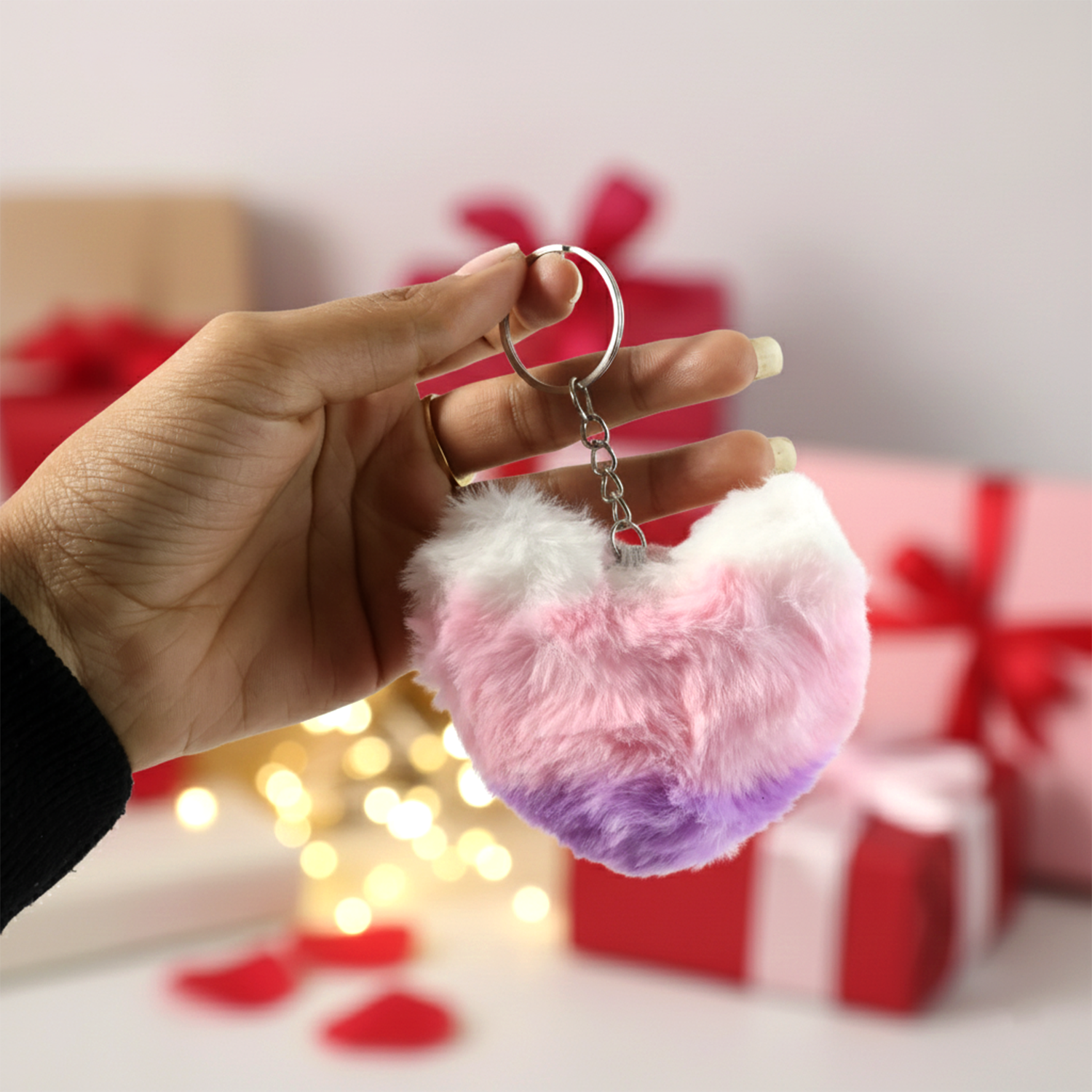 Soft plush heart keychain displayed on textured background