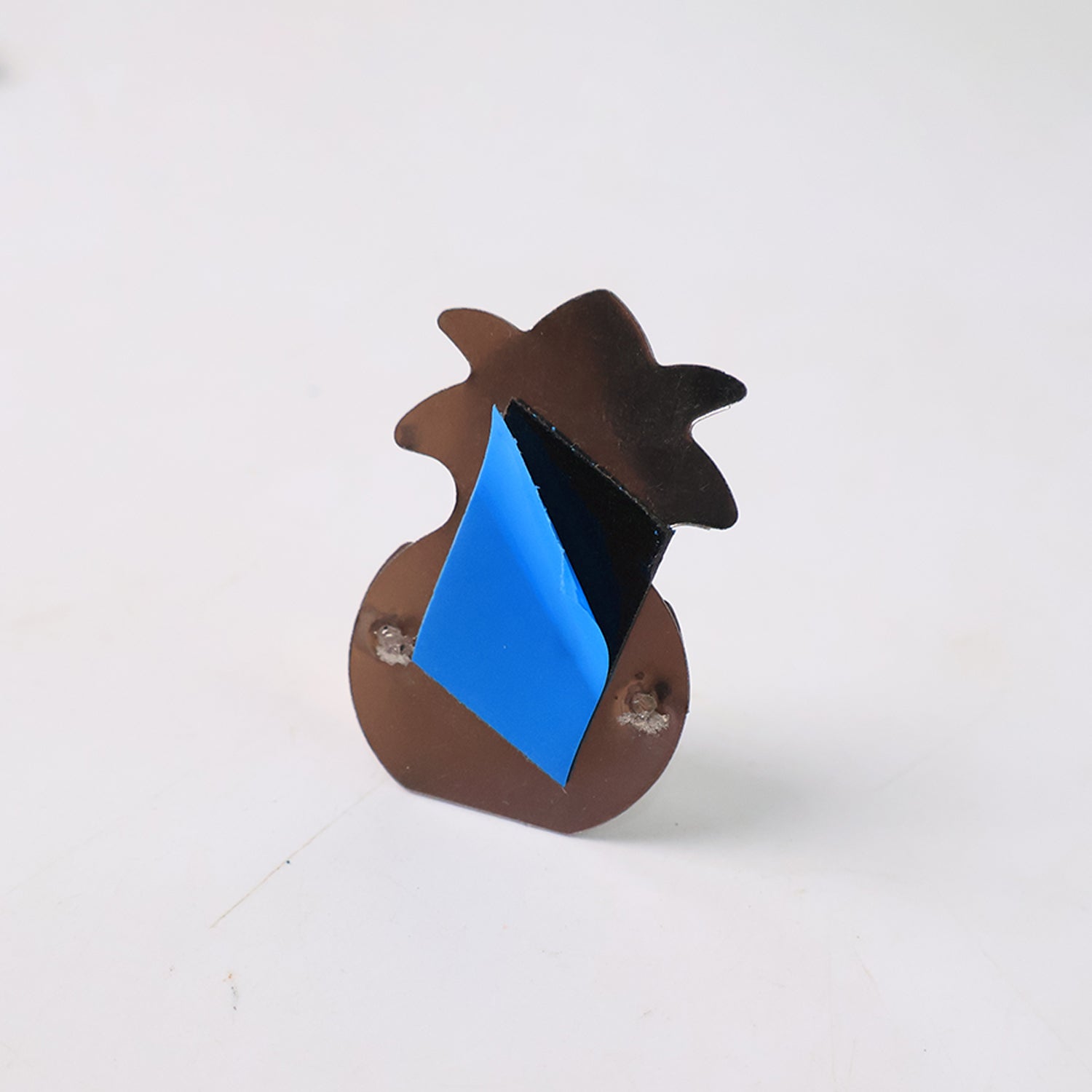 Close-up image of silver finish wall-mounted agarbatti holder with adhesive