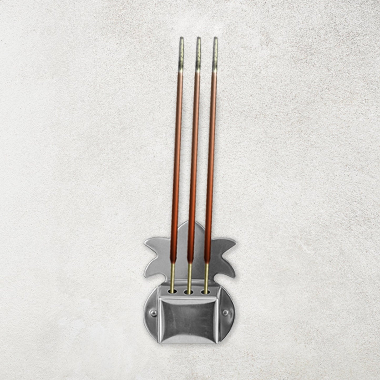 Set of three durable metal incense stick holders ideal for pooja room rituals.