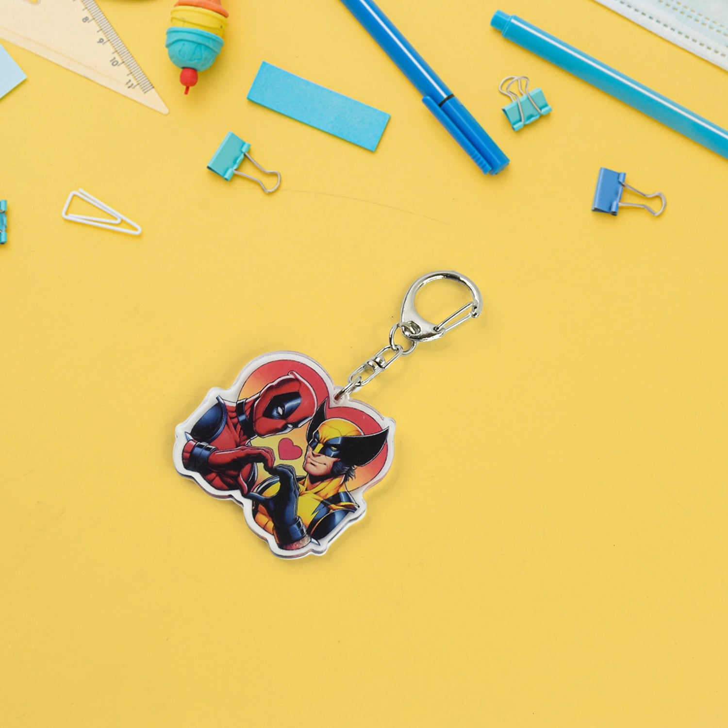 Fashionable acrylic keychain showing colorful cartoon characters and metal clasp