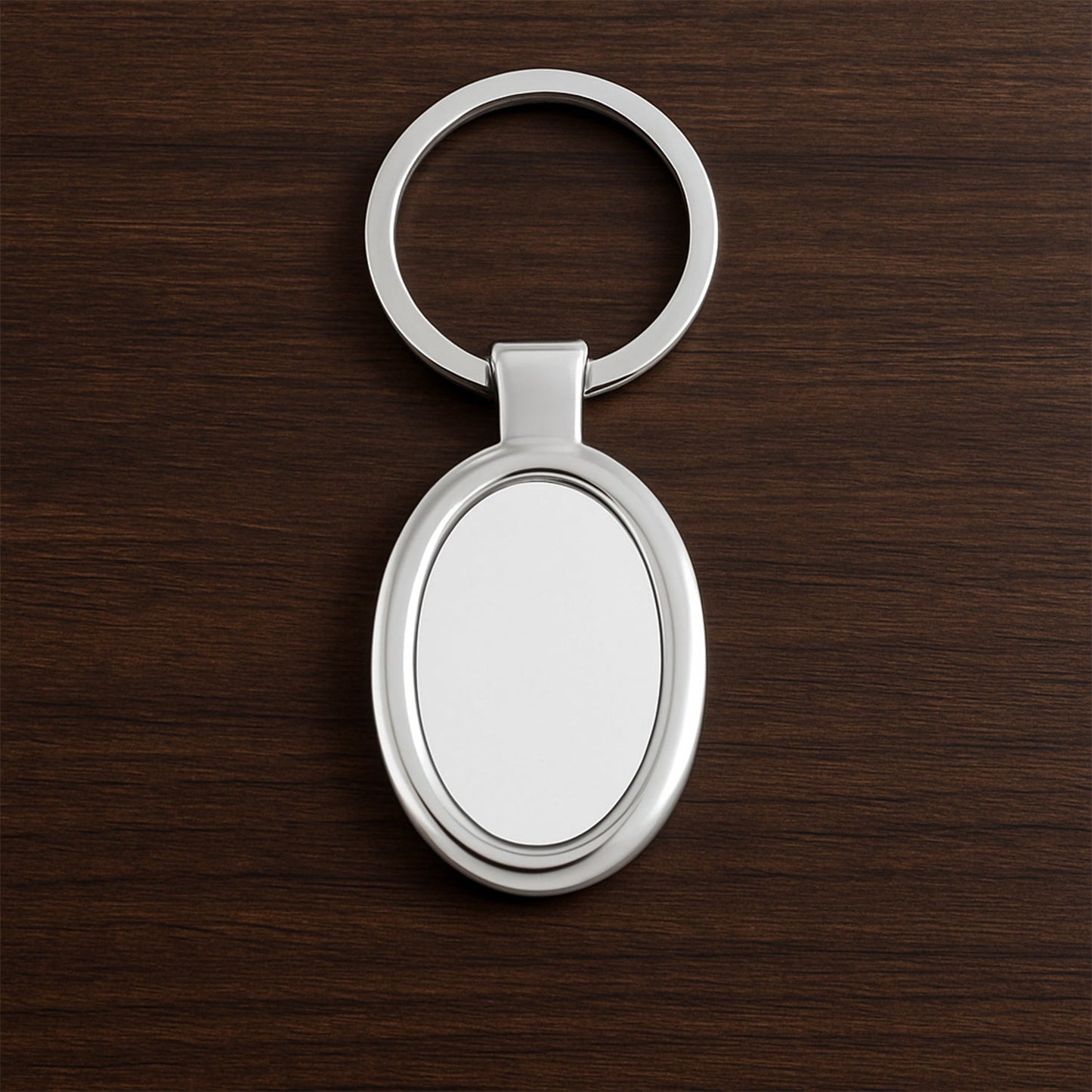 Sleek oval metal keychain showcasing durable build and chrome shine