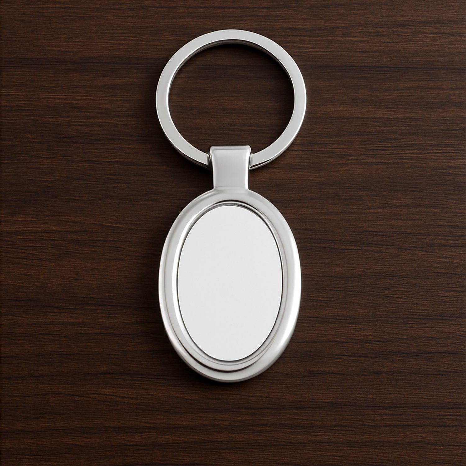 Sleek oval metal keychain showcasing durable build and chrome shine