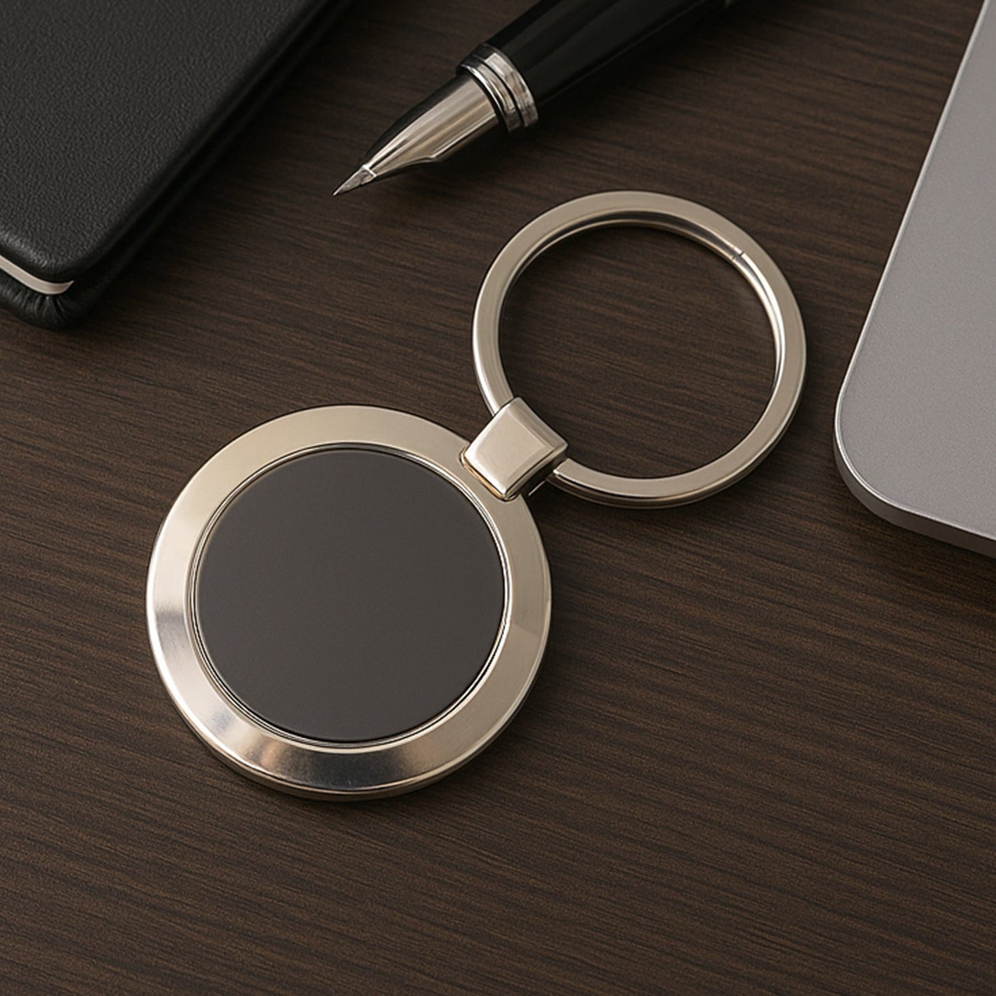 Durable round metal keychain with strong alloy build and black center.
