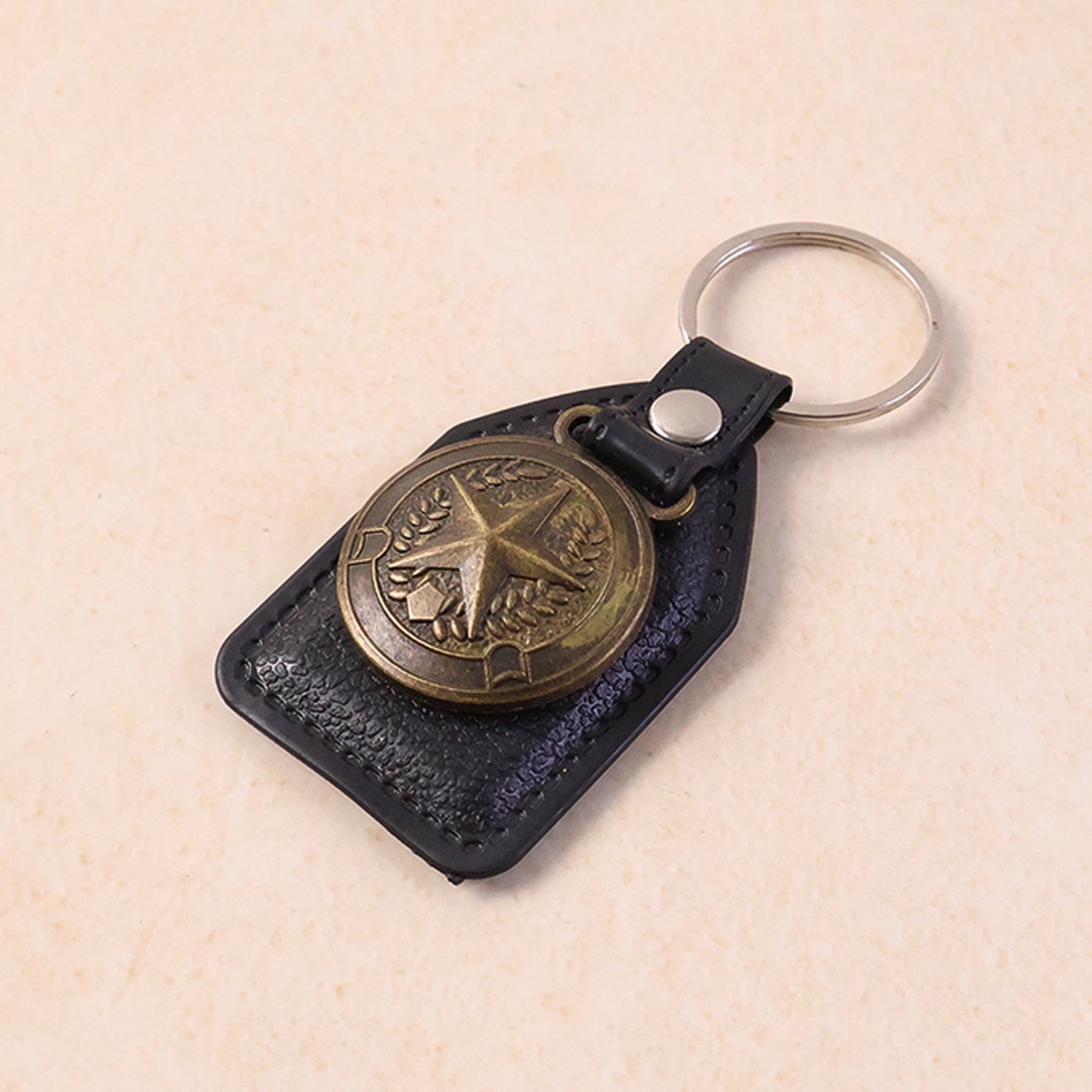 Premium leather style keychain featuring a metal star emblem