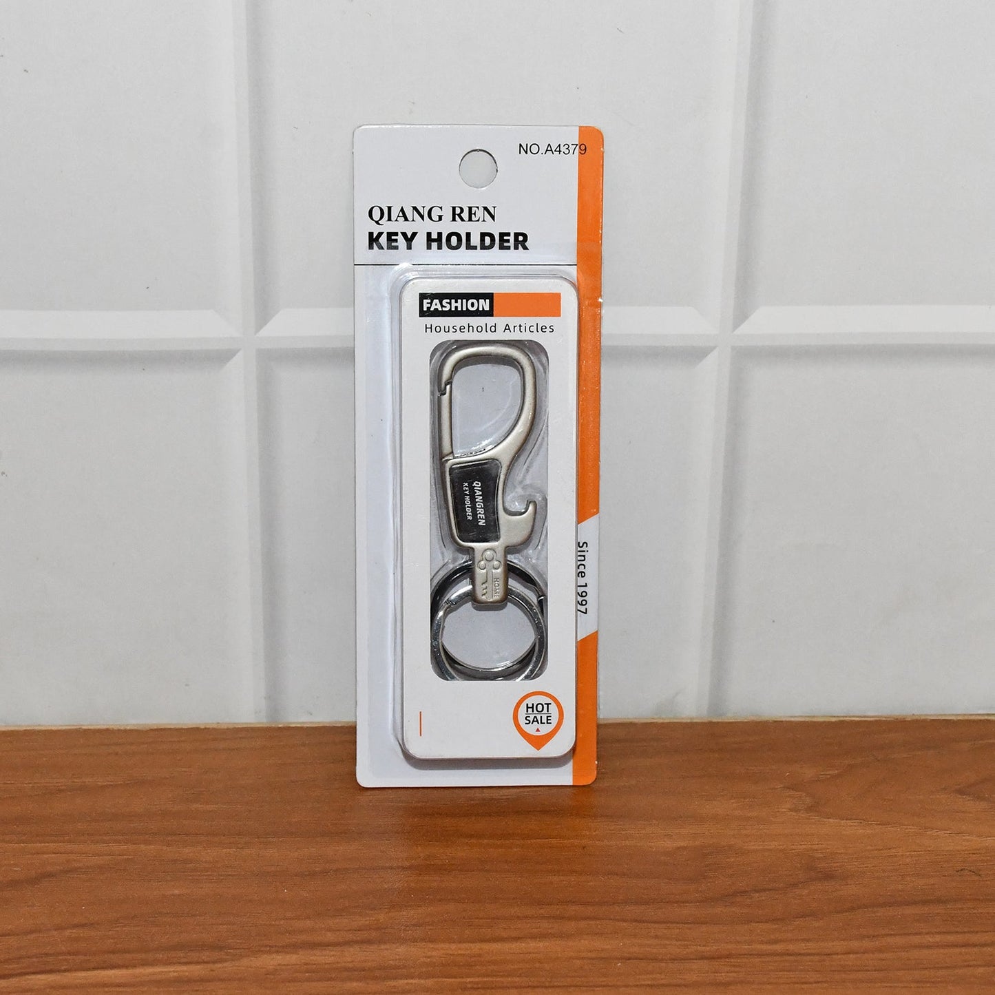 Metal carabiner keychain laid flat showing compact design