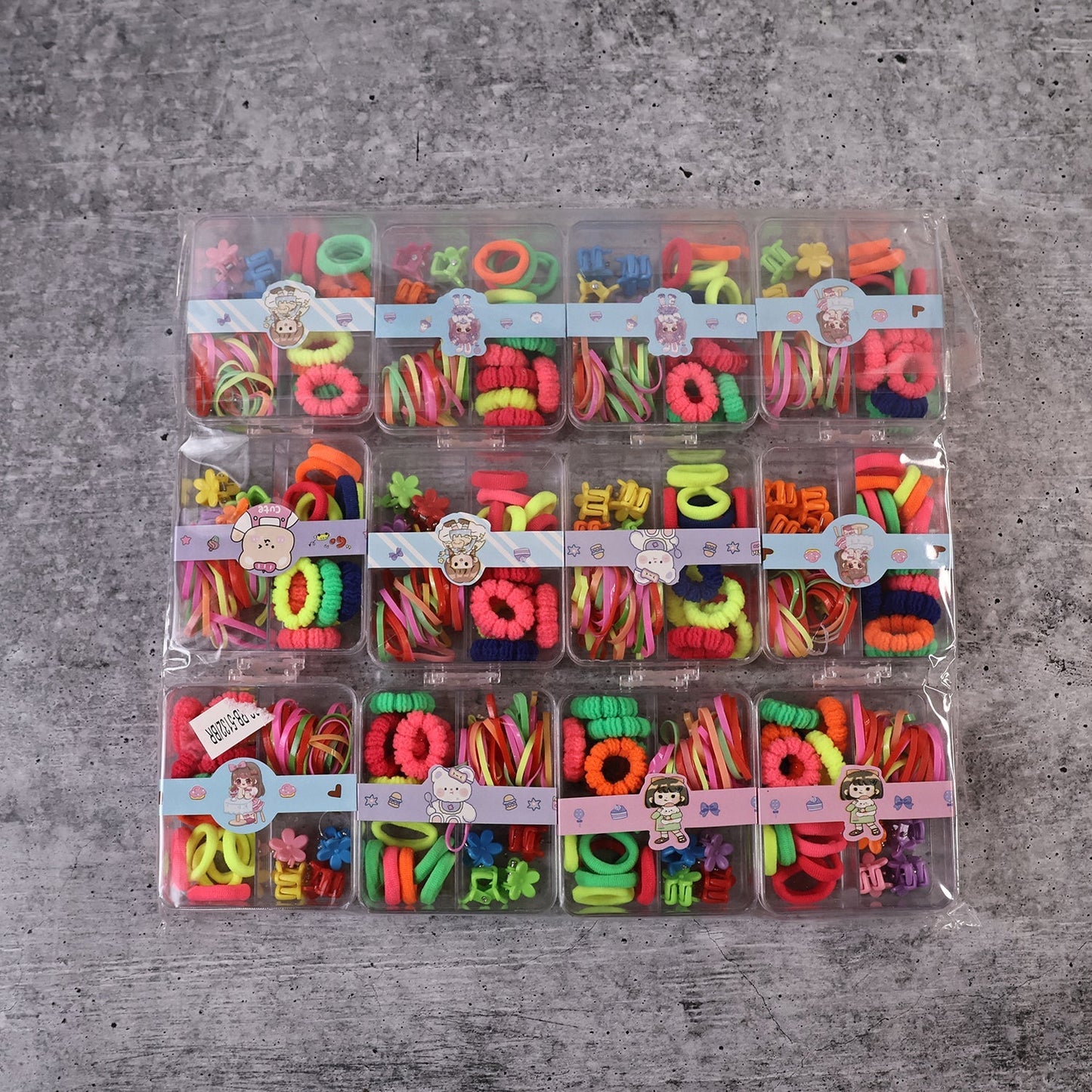 Complete kids hair accessories kit with elastic bands, rubber bands, and decorative clips.