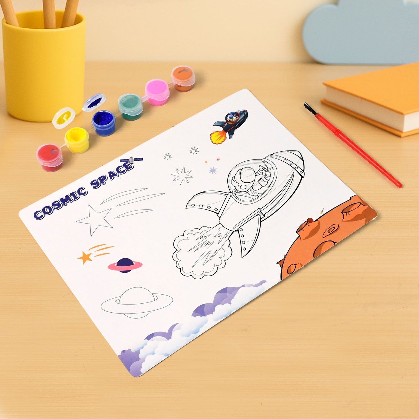 Pre-printed space-themed coloring sheet with rocket and astronaut from kids painting kit