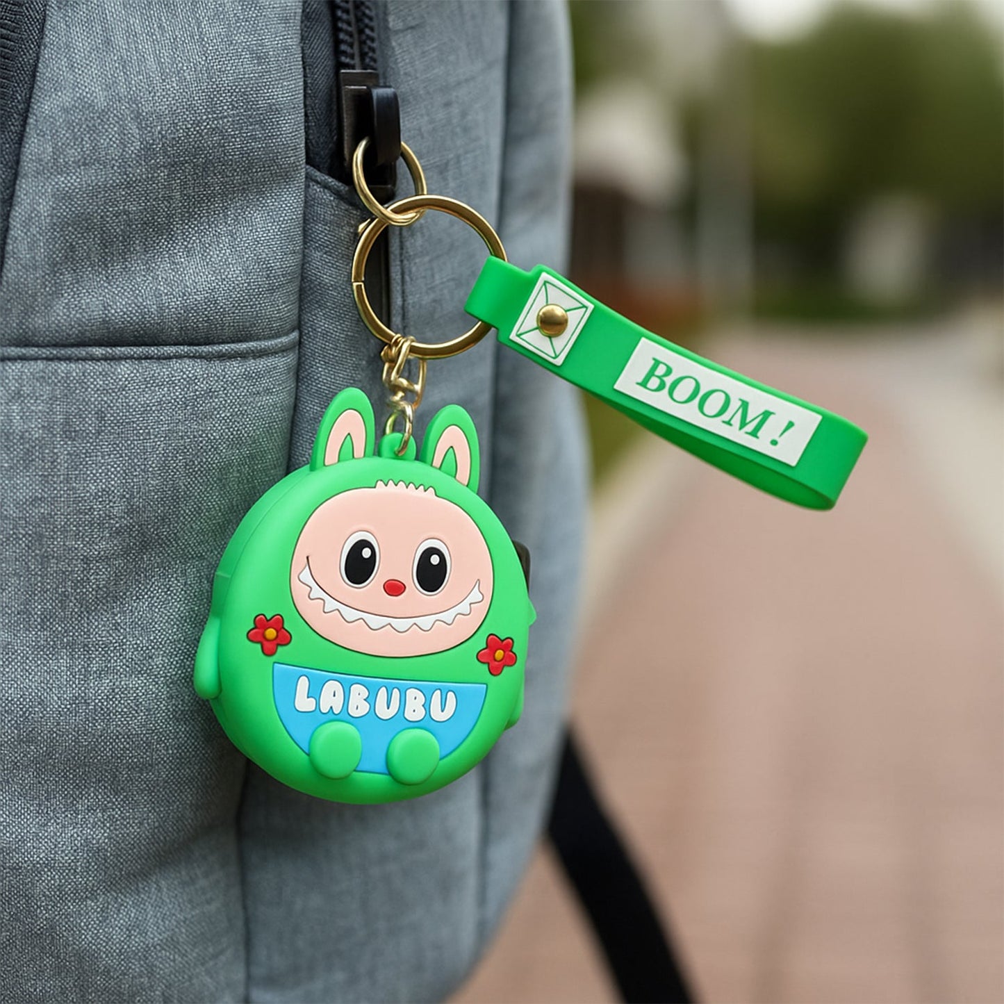 Cartoon coin pouch clipped onto a metal keyring for easy attachment
