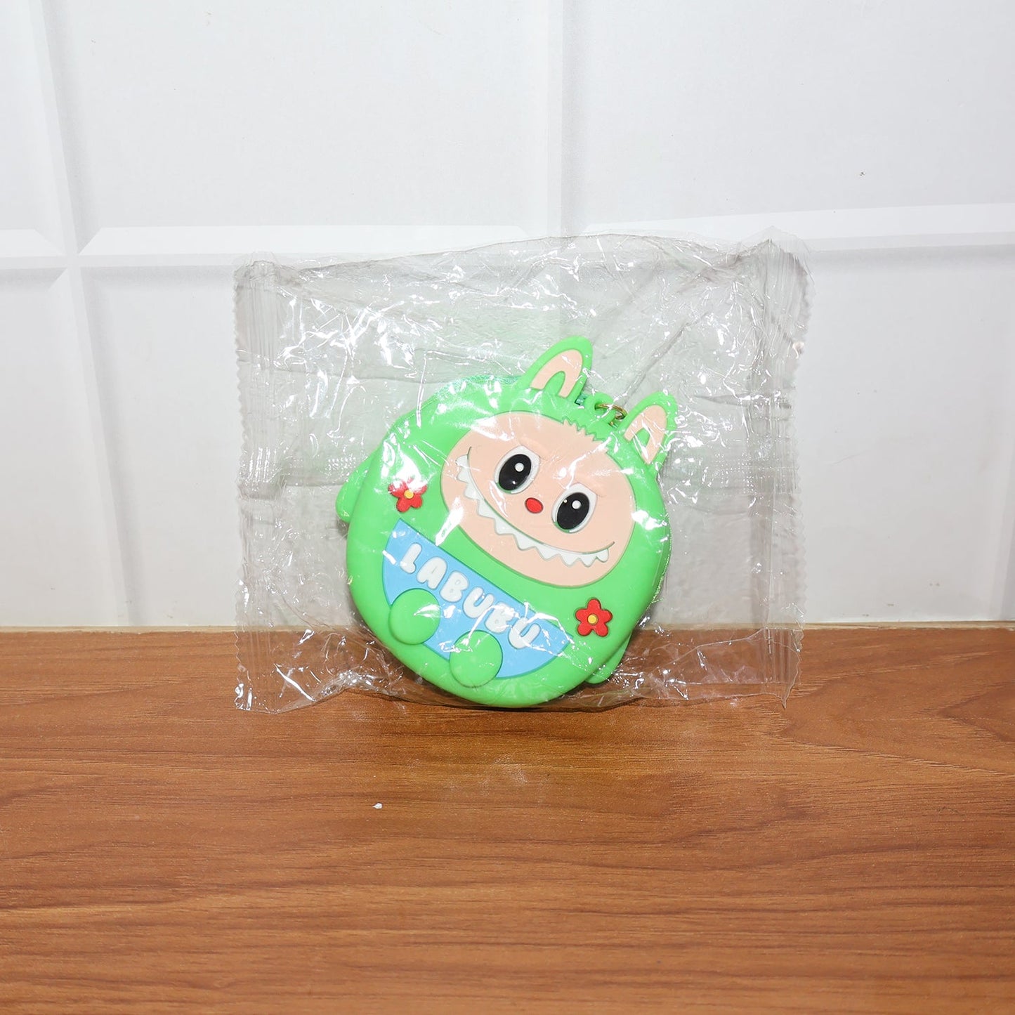 Cartoon coin pouch placed in a lifestyle setting showing portability