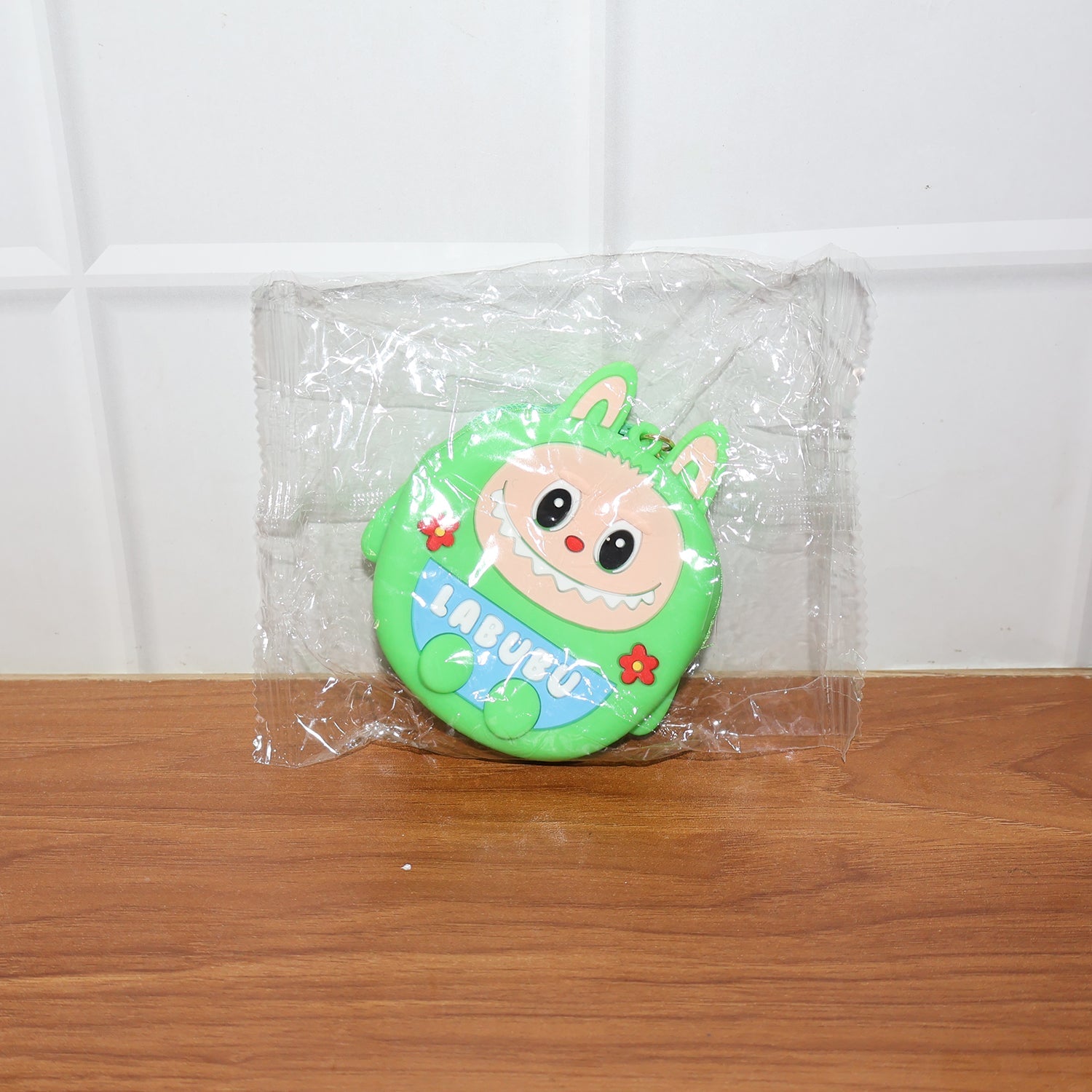 Cartoon coin pouch placed in a lifestyle setting showing portability