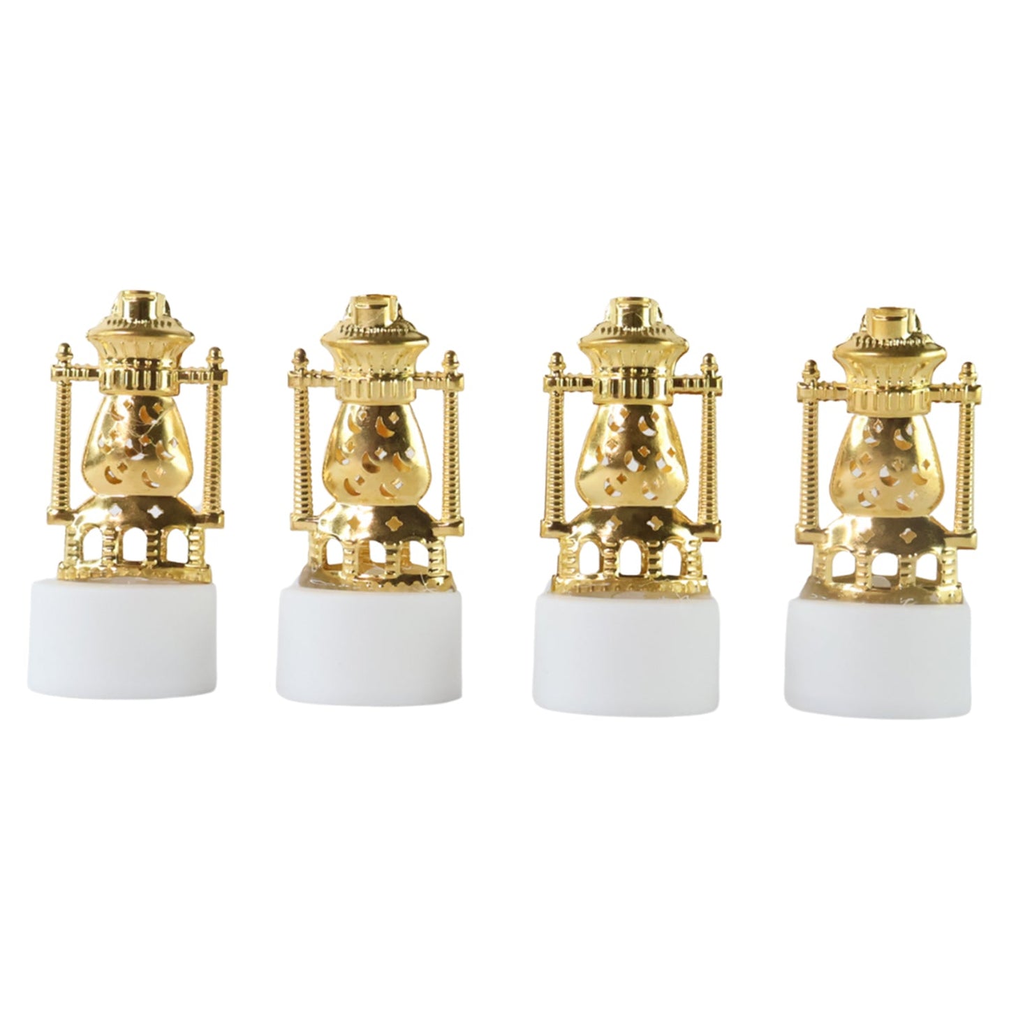 Three vintage lantern-style flameless LED tealights glowing in a dark setting.