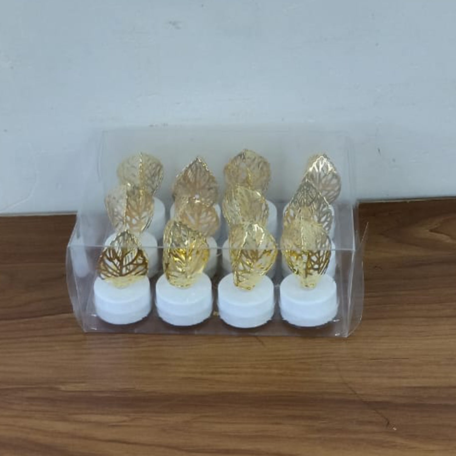 Romantic setting with golden leaf shaped flameless LED candle lighting