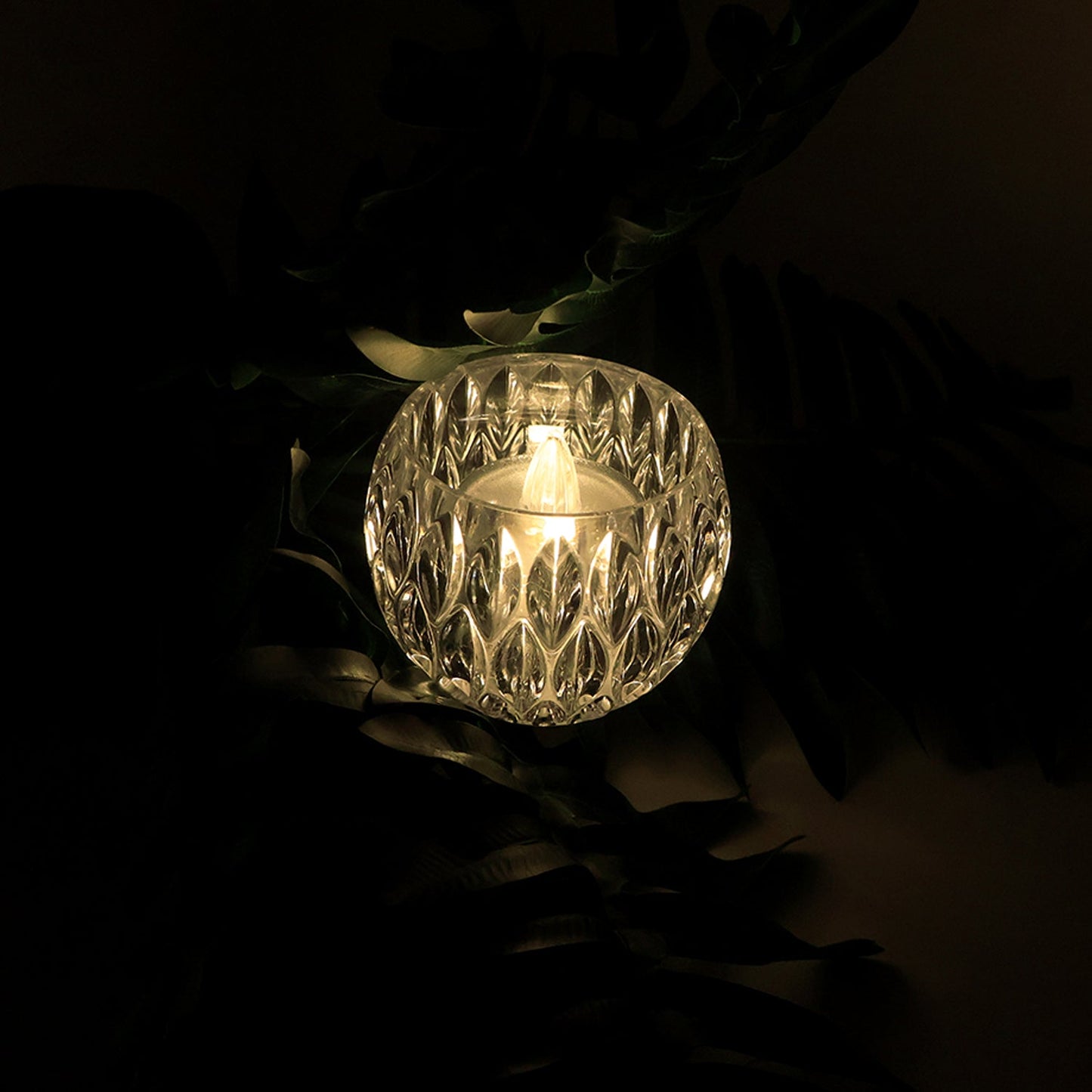 Close-up of crystal style LED decorative lamp showing diamond-cut design