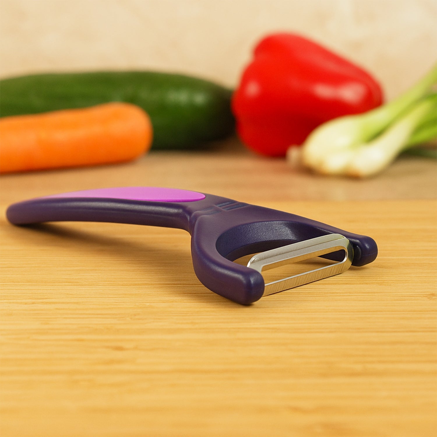 Dual tone vegetable peeler designed for comfortable grip and smooth peeling