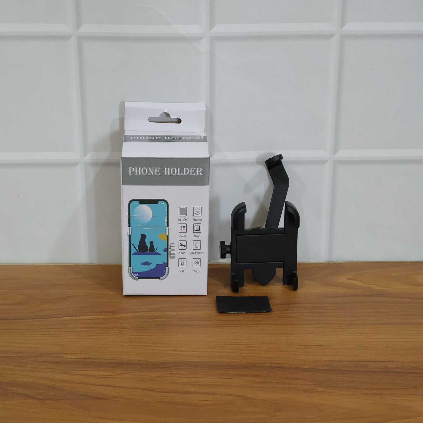 Metal bike phone holder mounted on a bike's rear view mirror, demonstrating easy installation.