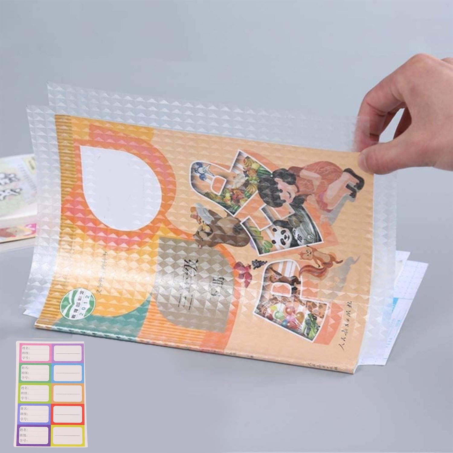 Transparent adhesive book cover sheets in various sizes for different books