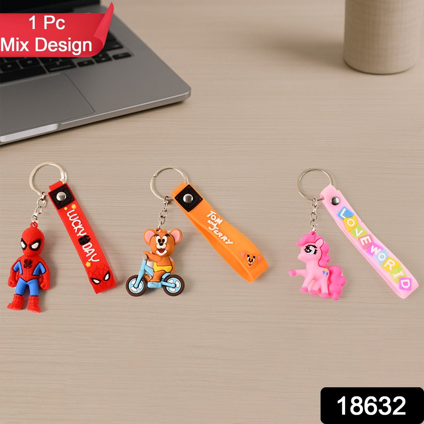 Close-up of a cute 3D cartoon silicone keychain with a metal hook and strap.