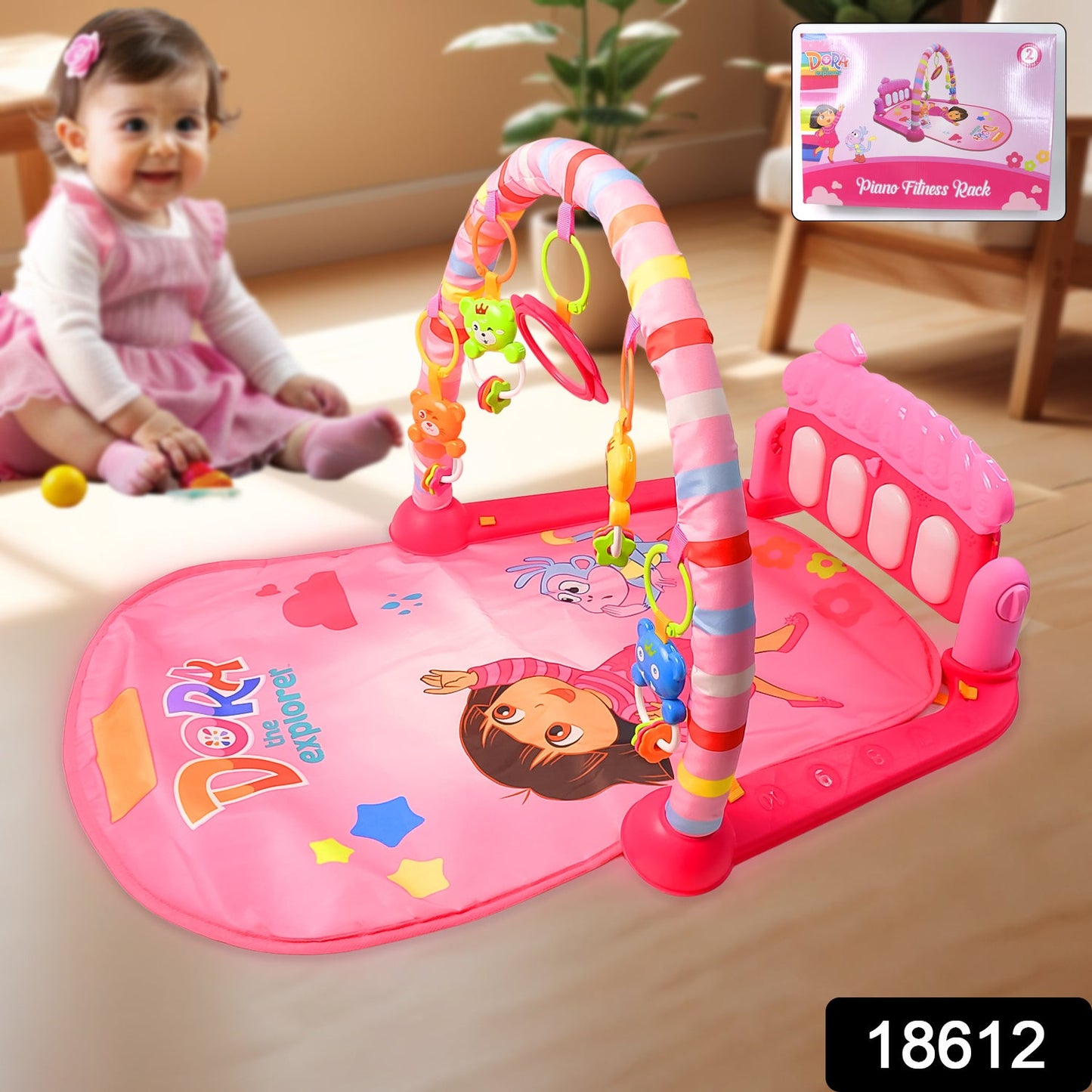 Infant kicking the musical piano on the Aditi baby play gym mat.